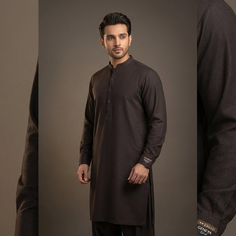 Man wearing a black kurta against a gray background
