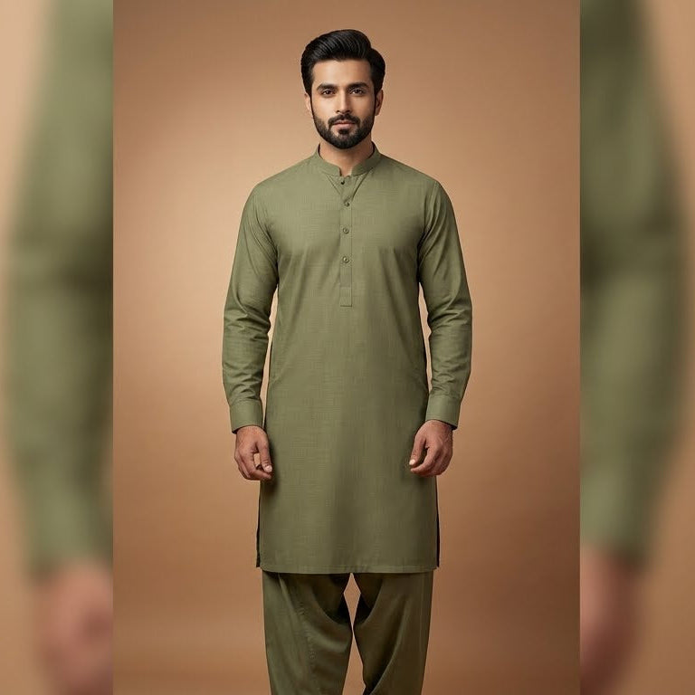 Man wearing a green kurta with a brown background