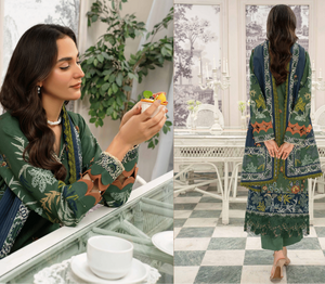 Woman in a green embroidered outfit in a stylish room with decor elements.