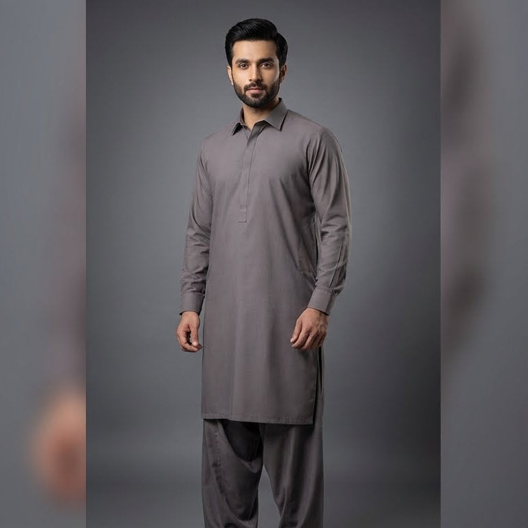 Man wearing a gray traditional outfit on a gray background