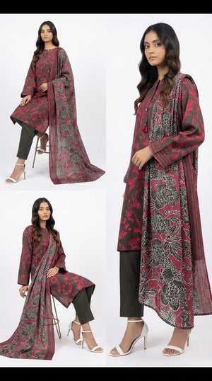 Woman wearing a red and black patterned outfit with a matching dupatta on a white background