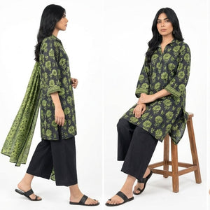 Woman modeling a green and black floral outfit with different poses on a white background