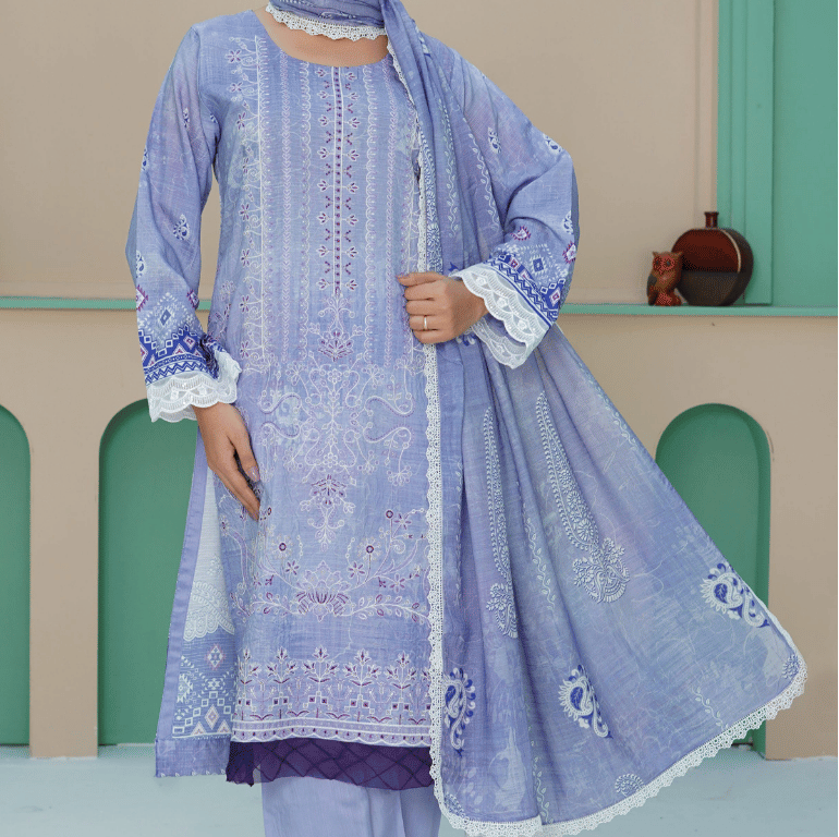 Woman wearing a light blue embroidered traditional outfit with a matching dupatta in a decorative setting.