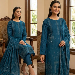 Woman in a blue traditional outfit posing in a well-lit room with large windows.