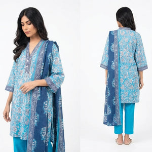 Woman modeling a blue patterned kurta with matching pants and dupatta on a white background