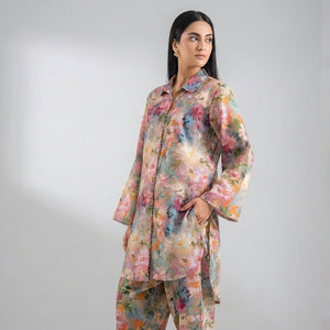 Woman wearing a floral outfit with close-up details on a gray background