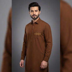 Man wearing a brown kurta with a logo on a gray background