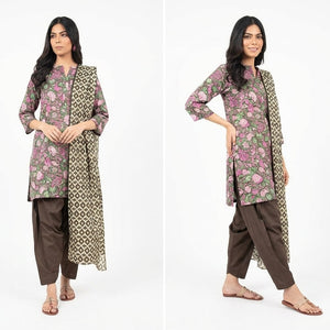 Woman wearing a floral patterned outfit with a long jacket on a white background