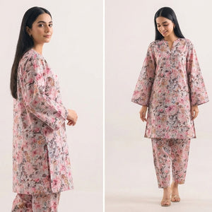 Woman modeling a pink floral outfit on a white background