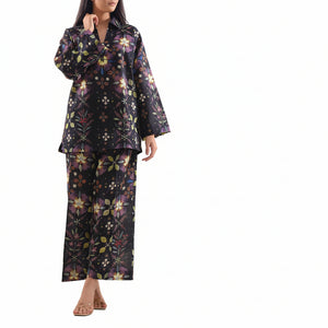 Woman wearing a floral two-piece outfit with Saya branding and product details.