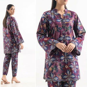 Floral patterned pajama set worn by a model on a white background