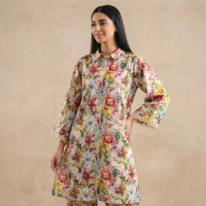 Woman wearing a floral dress against a beige background