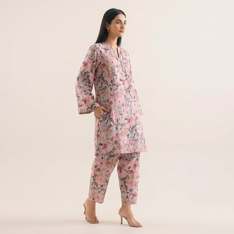 Woman wearing a floral pajama set on a beige background