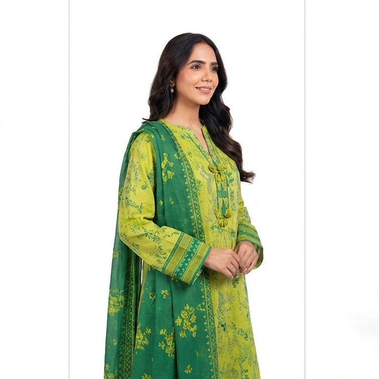 Woman wearing a green traditional outfit with floral patterns on a white background