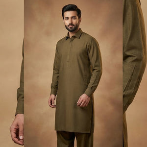 Man wearing a green kurta with pants against a brown background