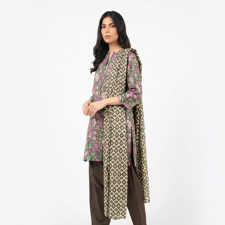 Woman wearing a patterned outfit on a white background