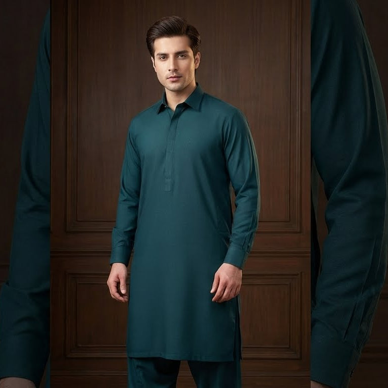 Man wearing a teal kurta against a dark wooden paneled wall