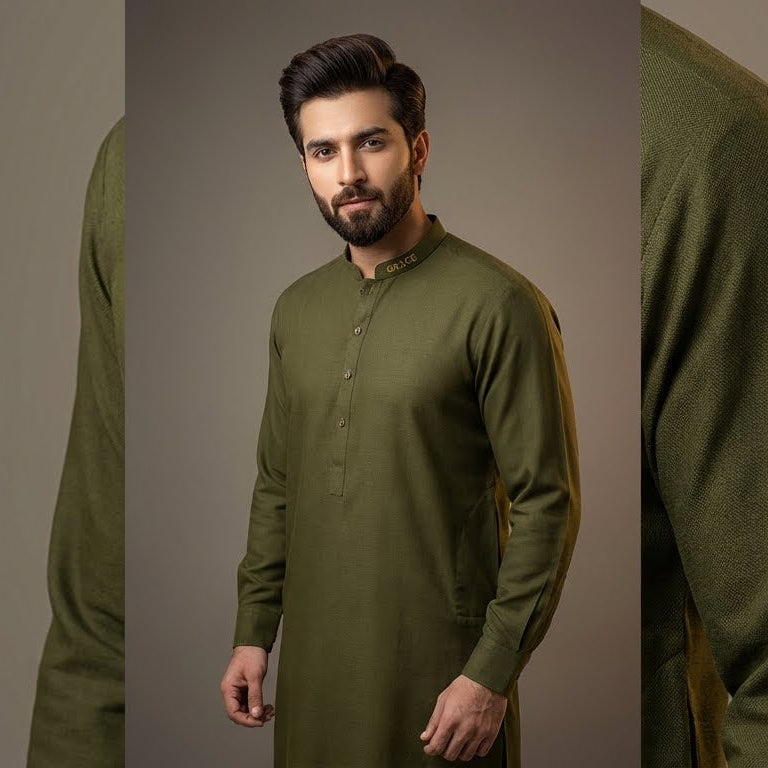 Man wearing a green traditional outfit against a gray background