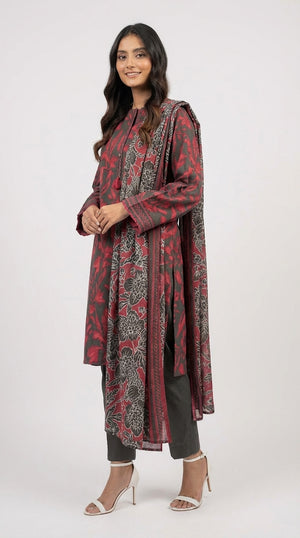 Woman wearing a red and black patterned outfit on a white background