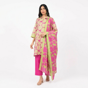 Woman wearing a pink and green floral outfit on a white background