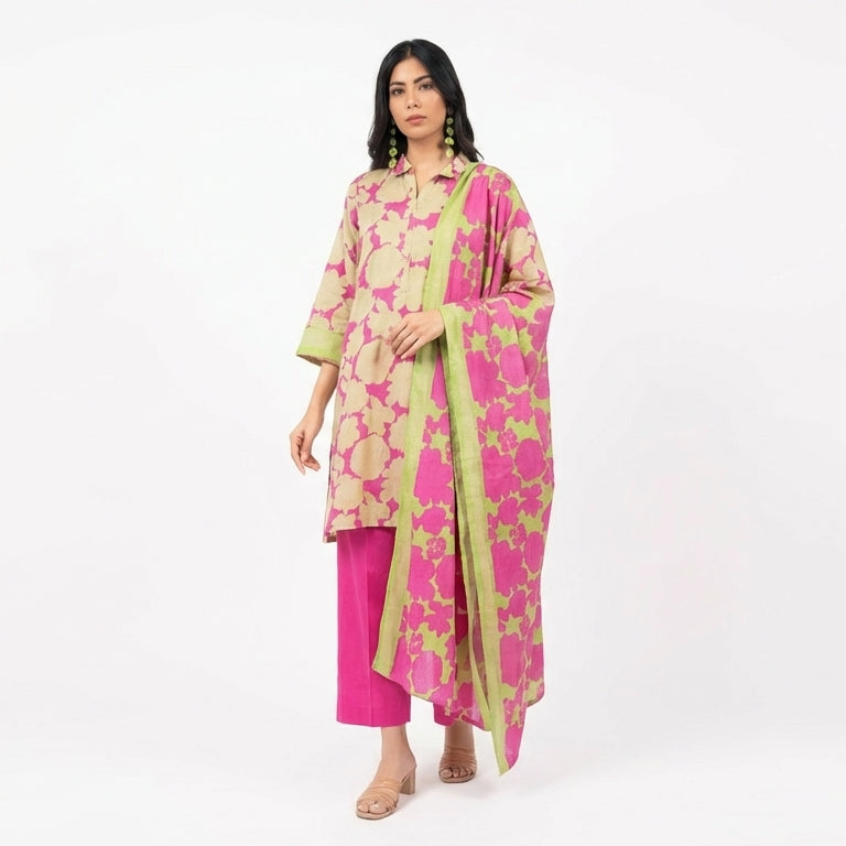 Woman wearing a pink and green floral outfit on a white background