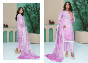 Woman wearing a pink traditional outfit with a matching dupatta in a decorated indoor setting.