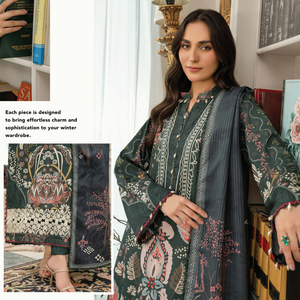 Woman wearing a dark green embroidered outfit with patterned shawl in a decorated room.