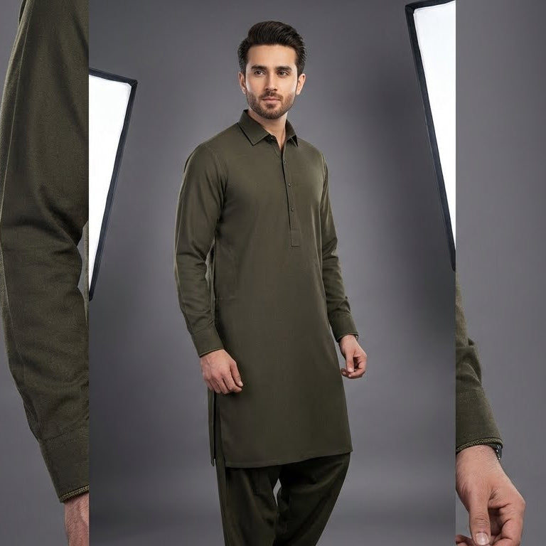 Man wearing a green traditional outfit against a gray background