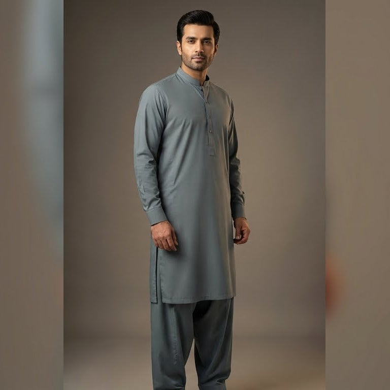 Man wearing a gray kurta with pants against a plain background