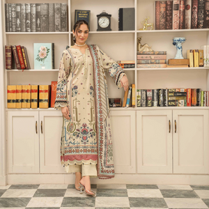 Woman in traditional attire standing in a room with bookshelves.