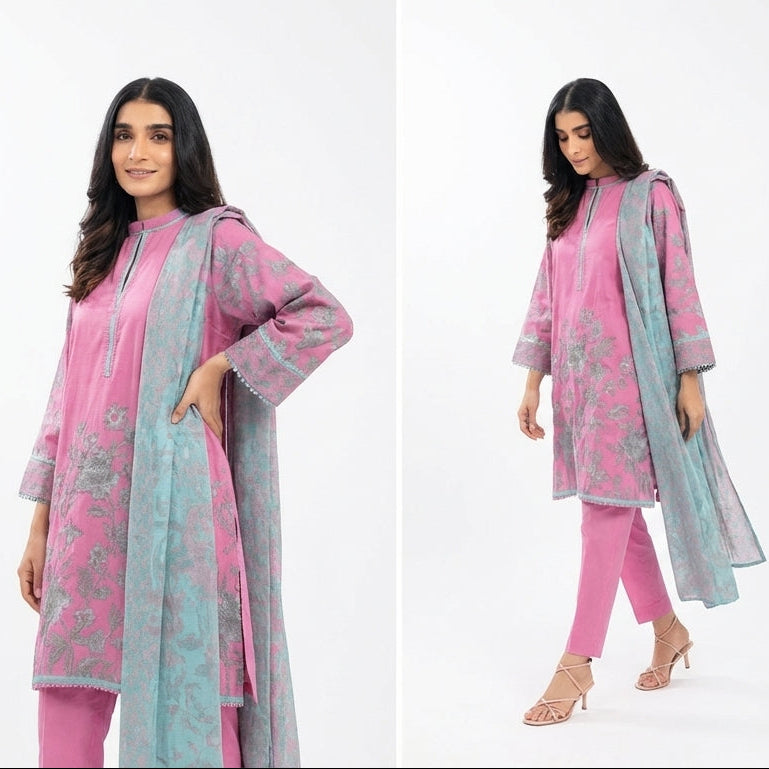 Woman modeling a pink and gray traditional outfit on a white background