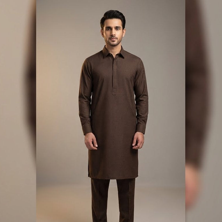 Man wearing a brown kurta against a neutral background
