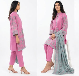 Woman modeling a pink and gray traditional outfit with a scarf on a white background