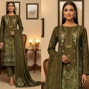 Two women in green embroidered traditional outfits standing in a decorated room.