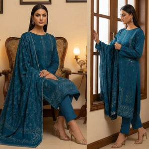 Woman in a blue traditional outfit with intricate patterns, sitting and standing in a decorated room.