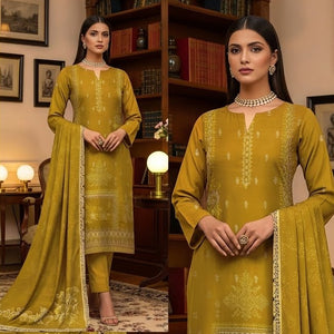 Woman in a yellow traditional outfit standing in a room with wooden furniture and framed pictures.
