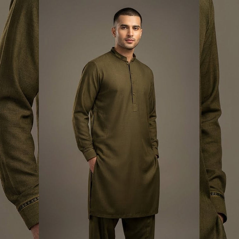 Man wearing an olive green traditional outfit against a gray background