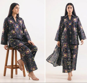 Woman wearing a floral patterned outfit on a white background