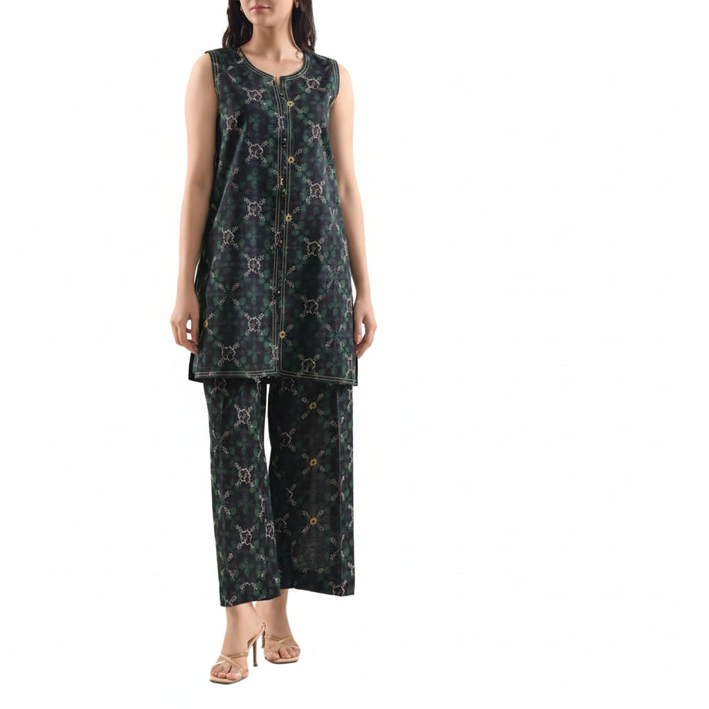 Woman wearing a green printed cotton khaddar set with Saya branding on the right side.