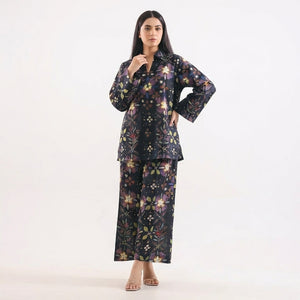 Woman wearing a floral outfit on a white background