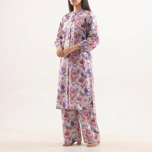 Woman wearing a floral outfit on a white background