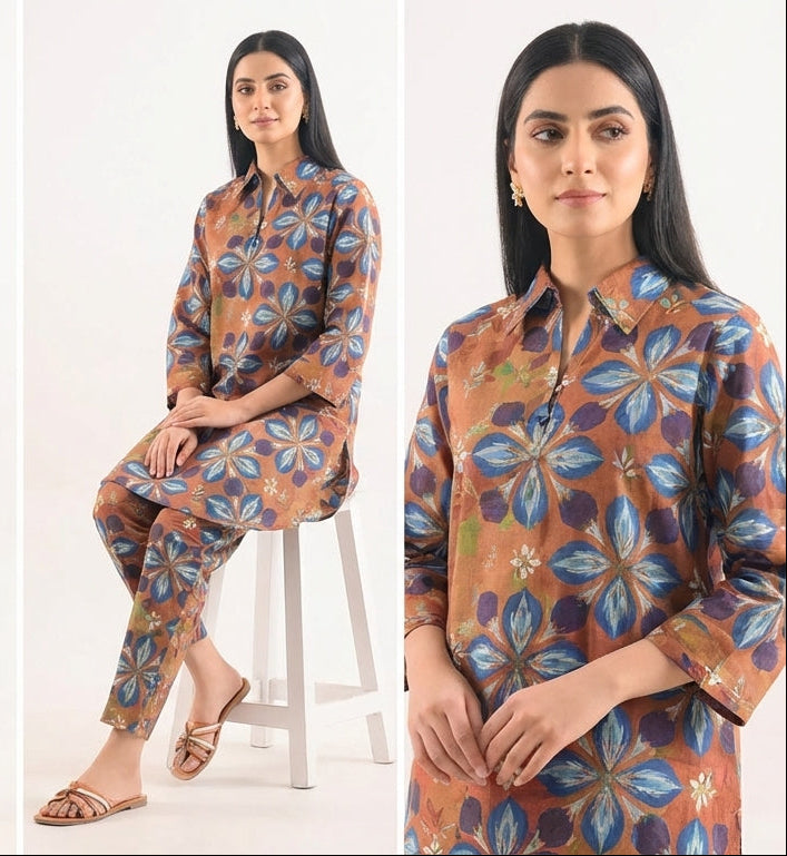 Woman wearing a floral patterned outfit on a white background