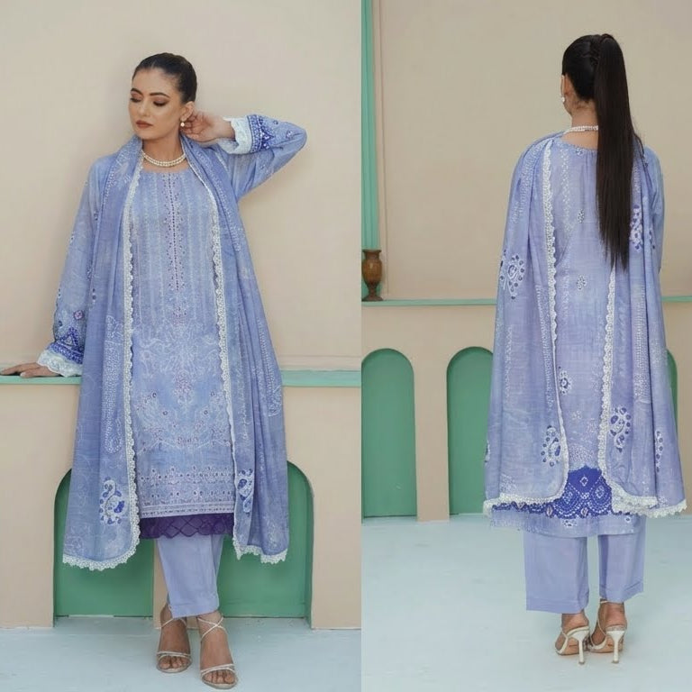Woman modeling a light blue traditional outfit with matching pants and shawl in a minimalistic setting.