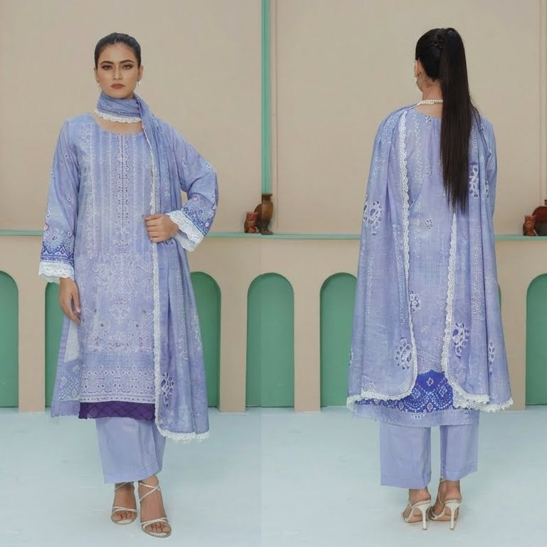 Woman in a light blue traditional outfit standing in front of a decorative wall.