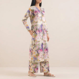 Woman wearing a floral dress on a beige background