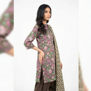 Woman wearing a floral dress with a matching scarf on a white background