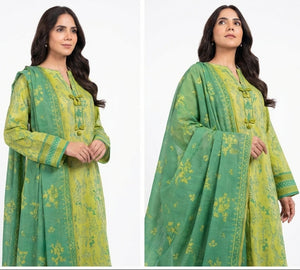 Woman wearing a green and yellow traditional outfit on a white background